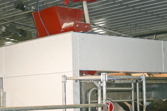 System designed to deliver high-moisture corn to cows when they come to be milked