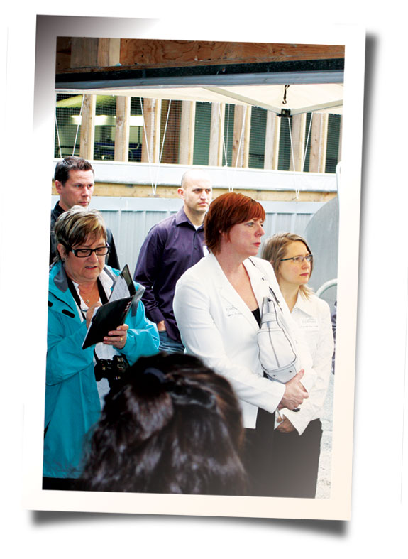 Tour group listening near disgester
